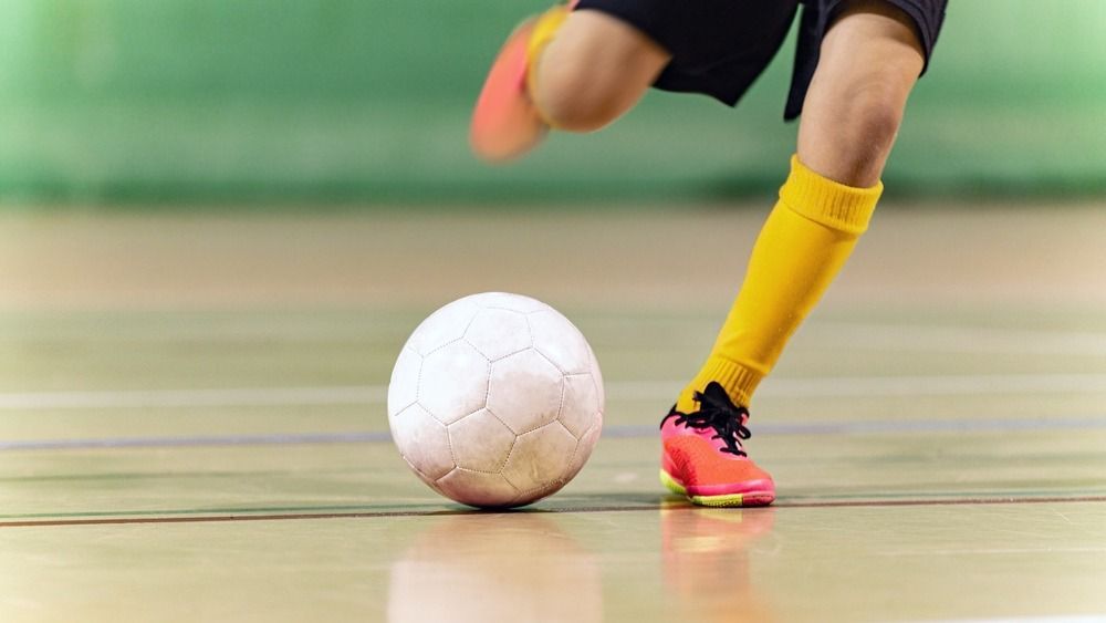 Close-up,Image,Of,Futsal,Player,Kicking,Ball.,Indoor,Soccer,Ball