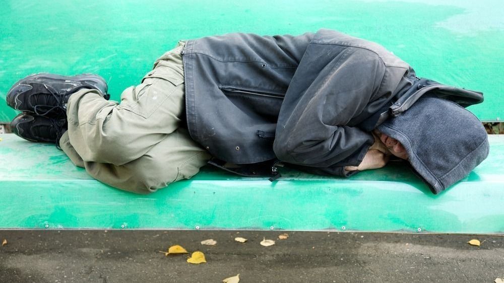 Sleeping,Homeless,Man,On,The,Bench