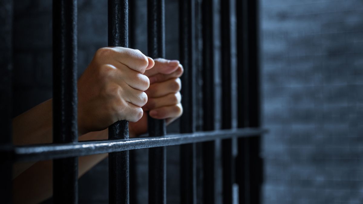 Women's,Hands,Holding,Prison,Railings